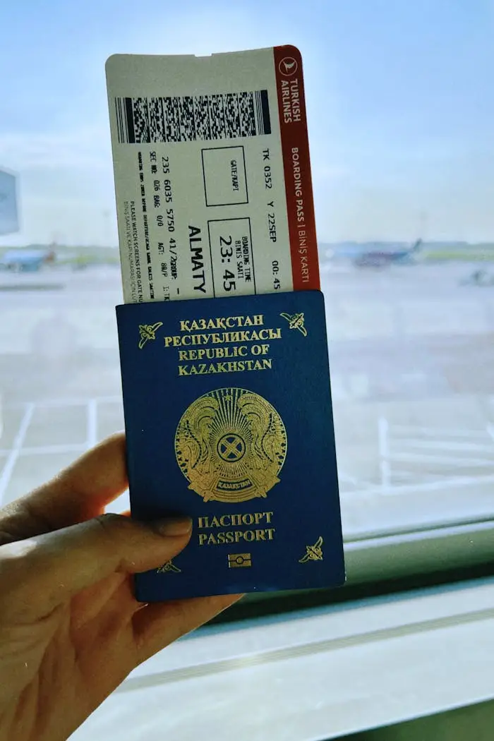 Crafting Captivating Headlines: Your awesome post title goes here Kazakhstan passport with boarding pass in Warsaw airport, ready for travel.
